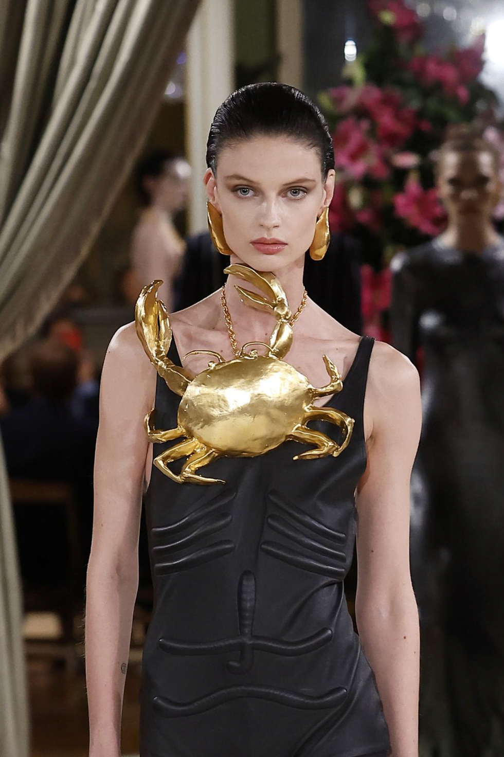 a woman wearing a gold dress a woman wearing a gold dress