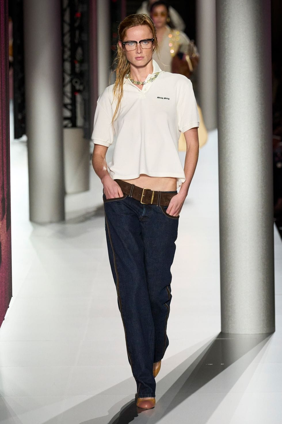 a person standing in a hallway a person standing in a hallway